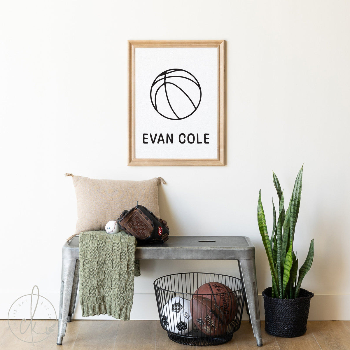 Personalized basketball name sign for boys room decor featuring a custom name and basketball graphic, perfect for sports-themed nursery or kids&amp;#39; room, displayed in a modern setting with sports equipment and plant decor.